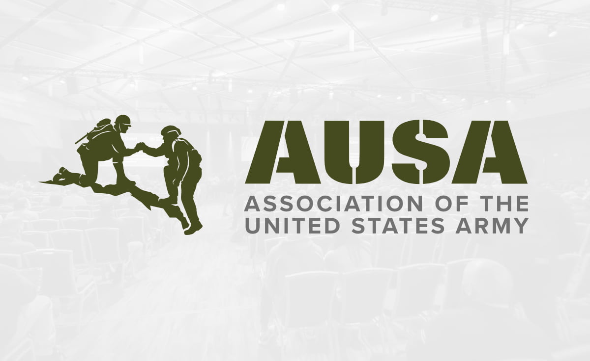 AUSA logo overlayed on a textured grey background
